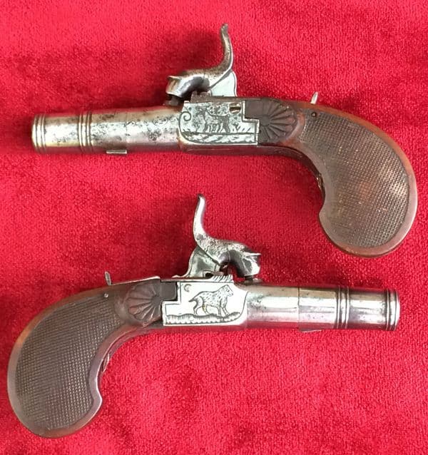 An unusual pair of continental Percussion pocket pistols with folding triggers. Circa 1840. Good condition. Ref 8562.